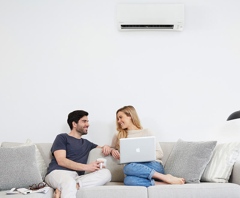 Couple On Couch By Ductless Ac